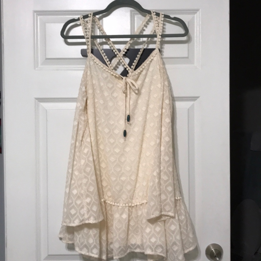 Strappy cream off the shoulder top